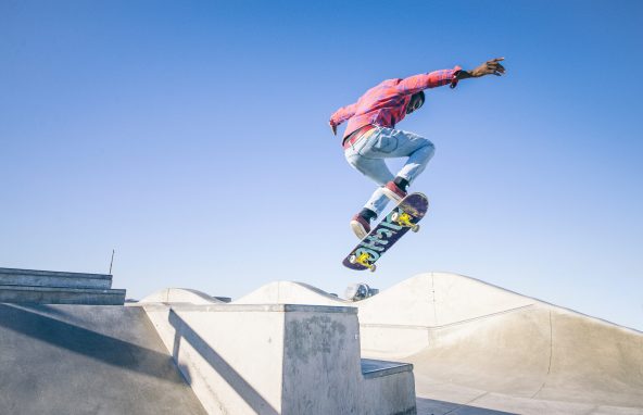 Skateboarder doing a trick in a skate park